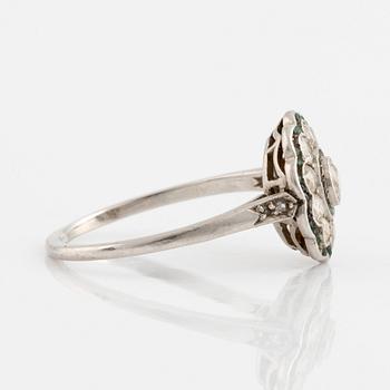 Platinum, emerald and brilliant cut diamond ring.