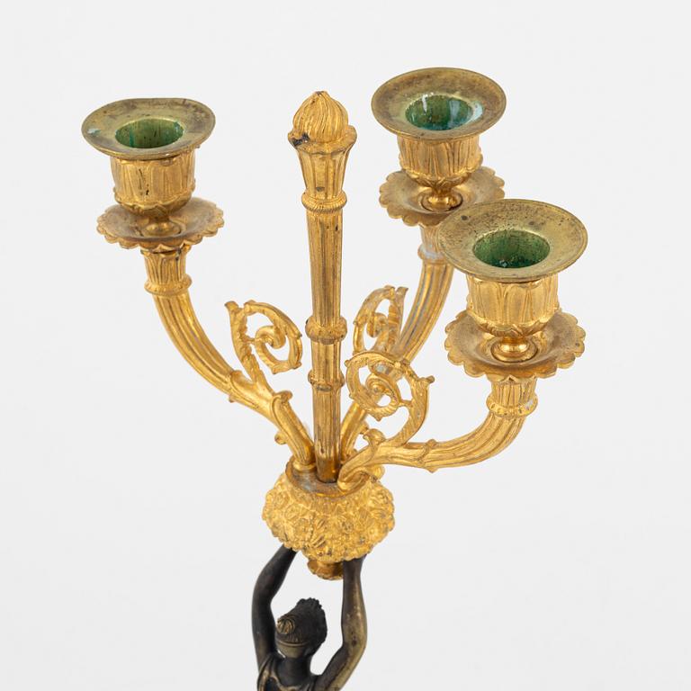 A pair of bronz empire style candelabras, 19th Century.