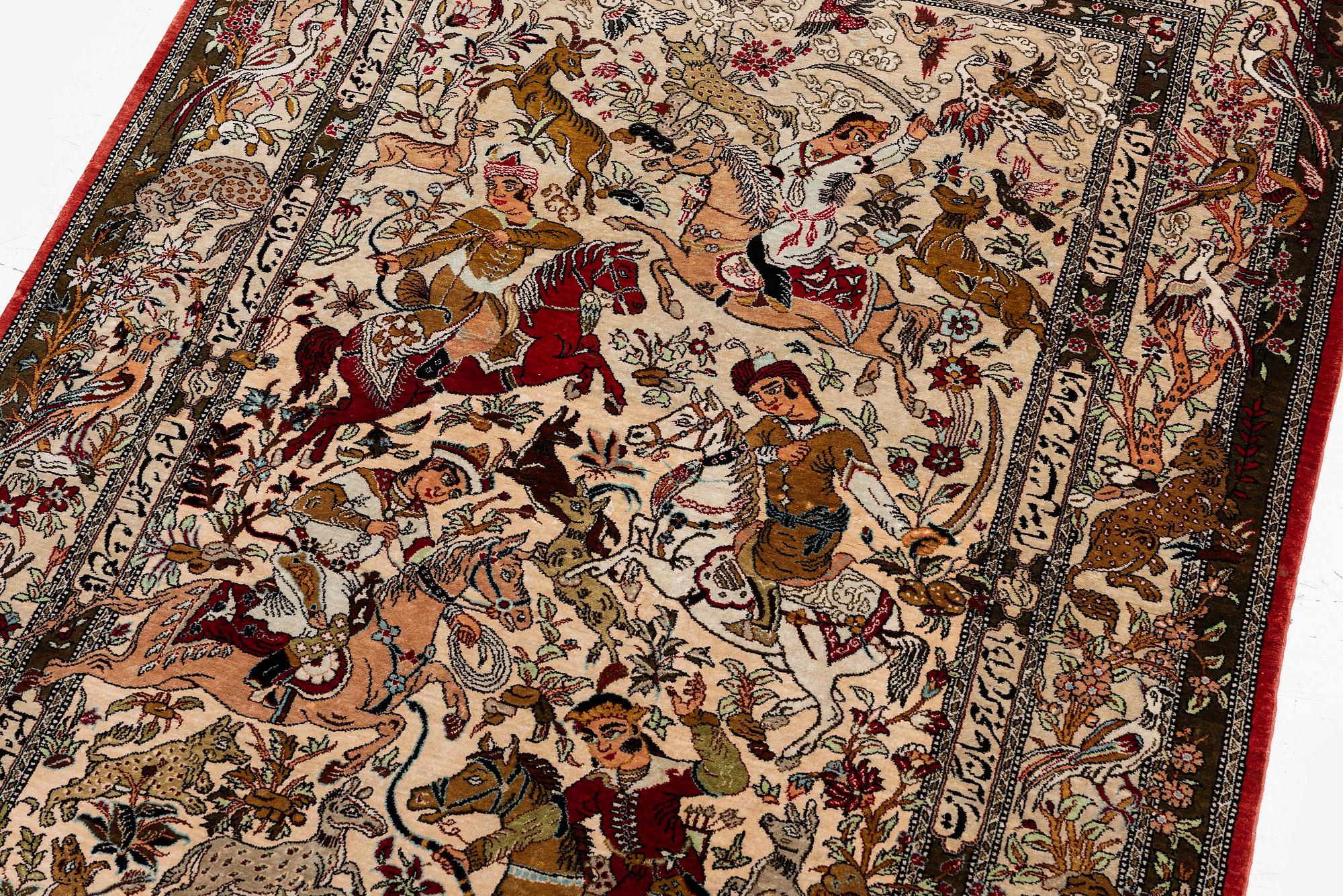 A silk Qum rug of 'hunting' design, c. 157 x 108 cm.