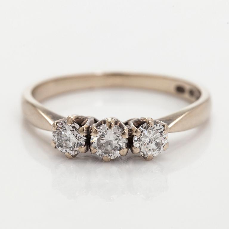 Ring, three brilliant cut diamonds, 18K white gold, H. Lahtinen & Co., 1985.
