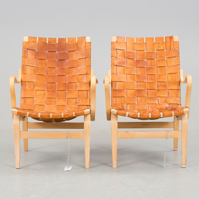 A pair of Bruno Mathsson "Eva" armchairs.