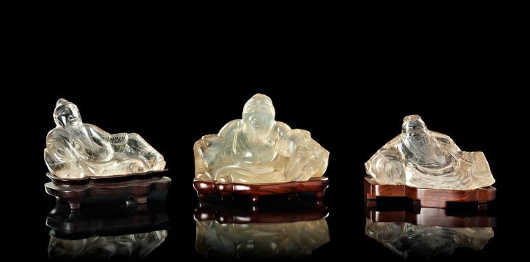 A set of three rock chrystal figures of reclining scholars, Qing dynasty.