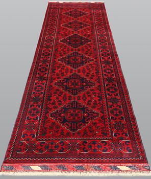 An Afghan runner, approx. 286 x 84 cm.