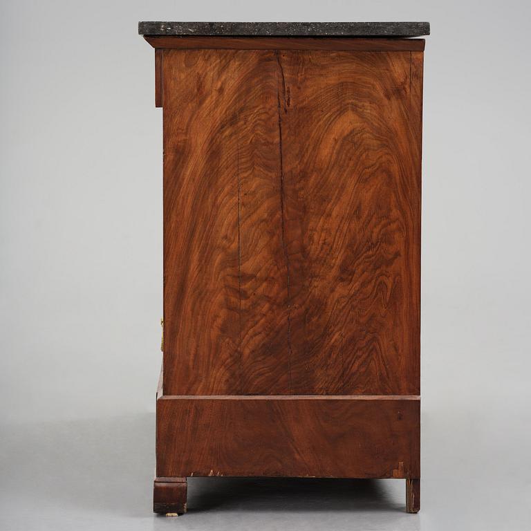 A French Empire mahogany commode, early 19th century.