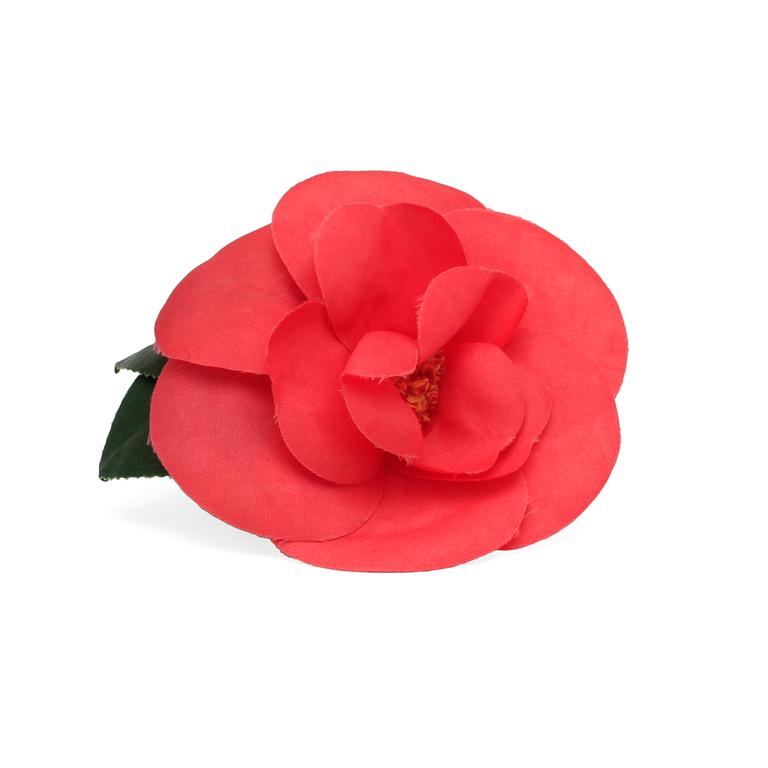 CHANEL, a red brooch.