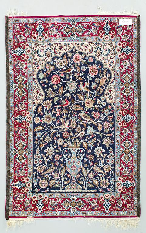 A silk rug from Isfahan. Approx. 166 x 110 cm.