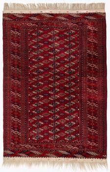 An oriental rug, c. 184 (+4cm flat weave on each end) x 133 cm.