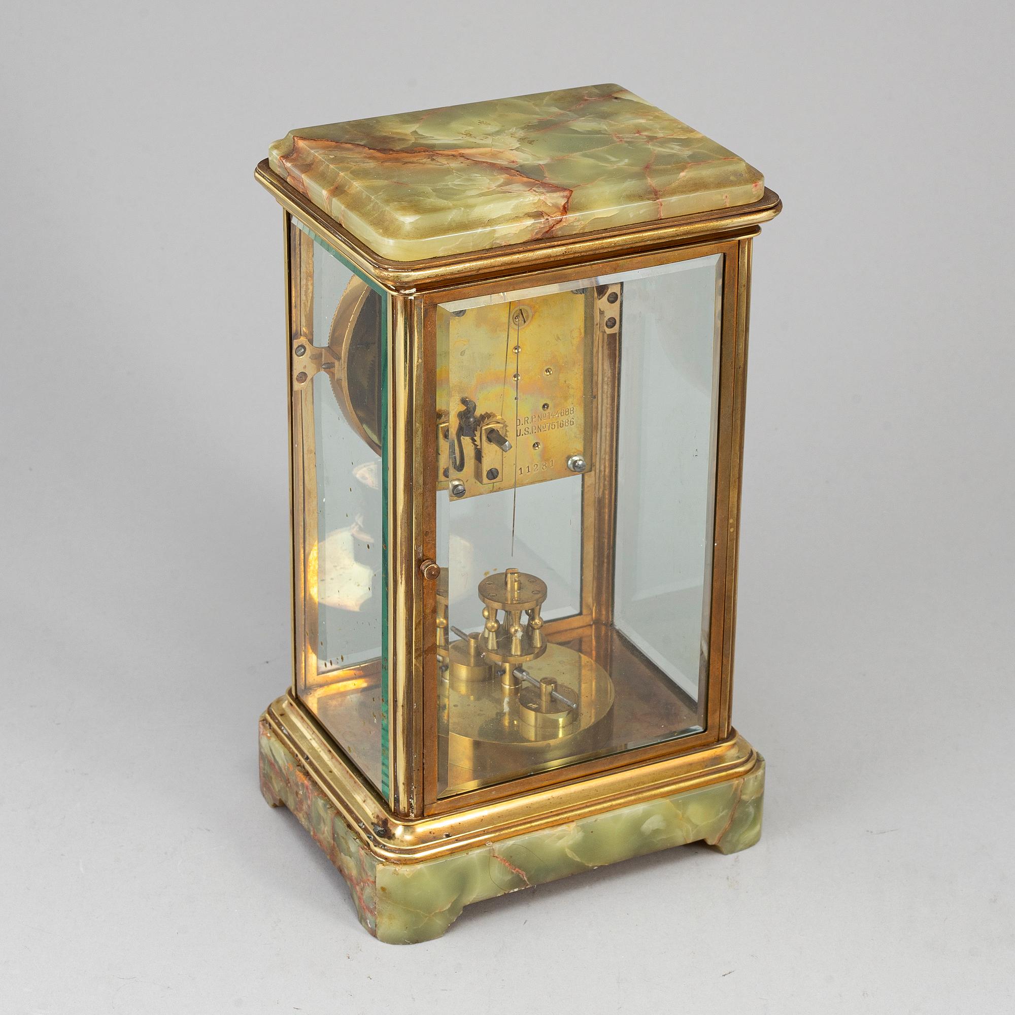 A French onyx and brass mantel clock, first half of the 20th century.