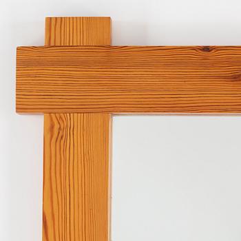 A 1980's pine mirror.