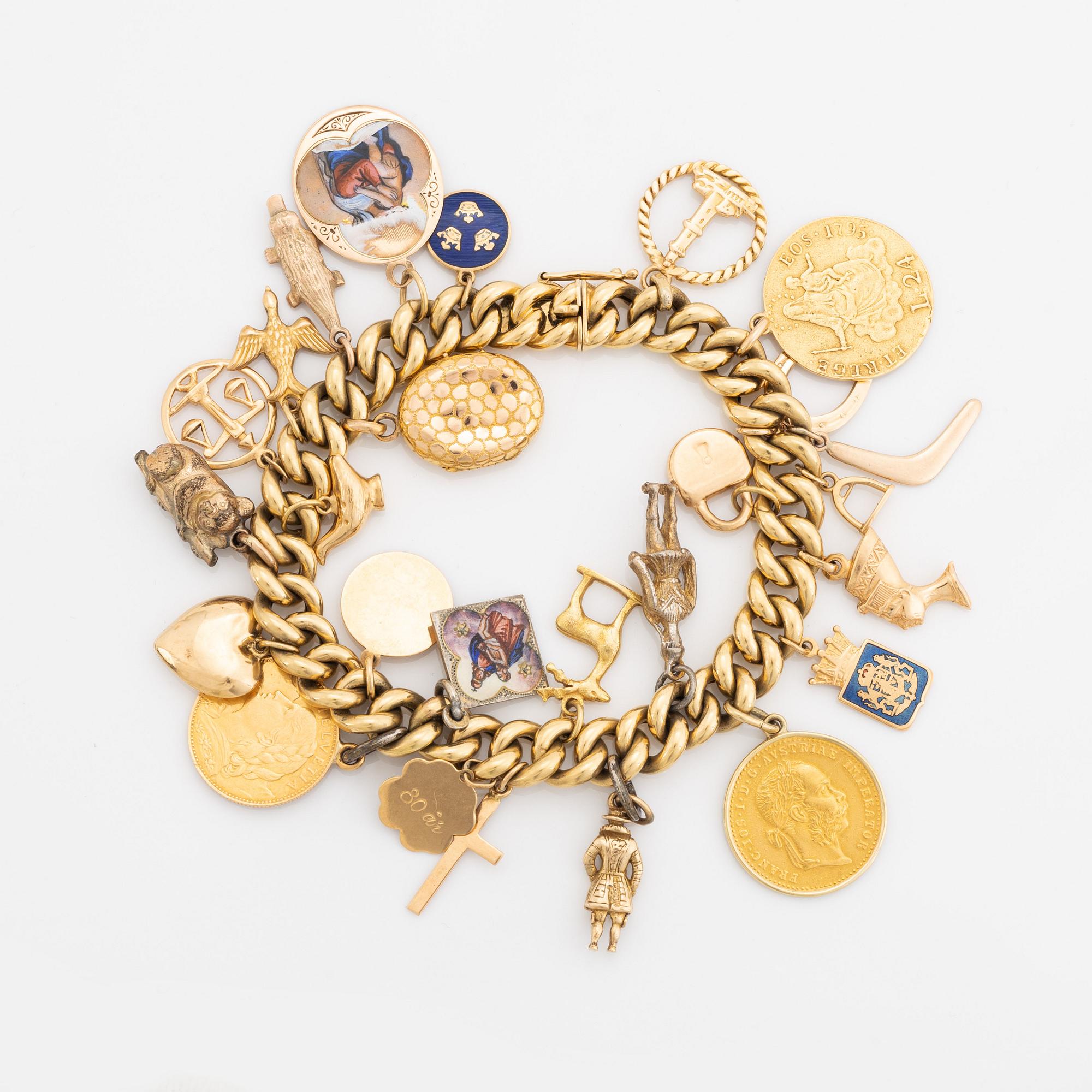 18K gold charm bracelet.