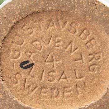 LISA LARSON, a set of four candle sticks.