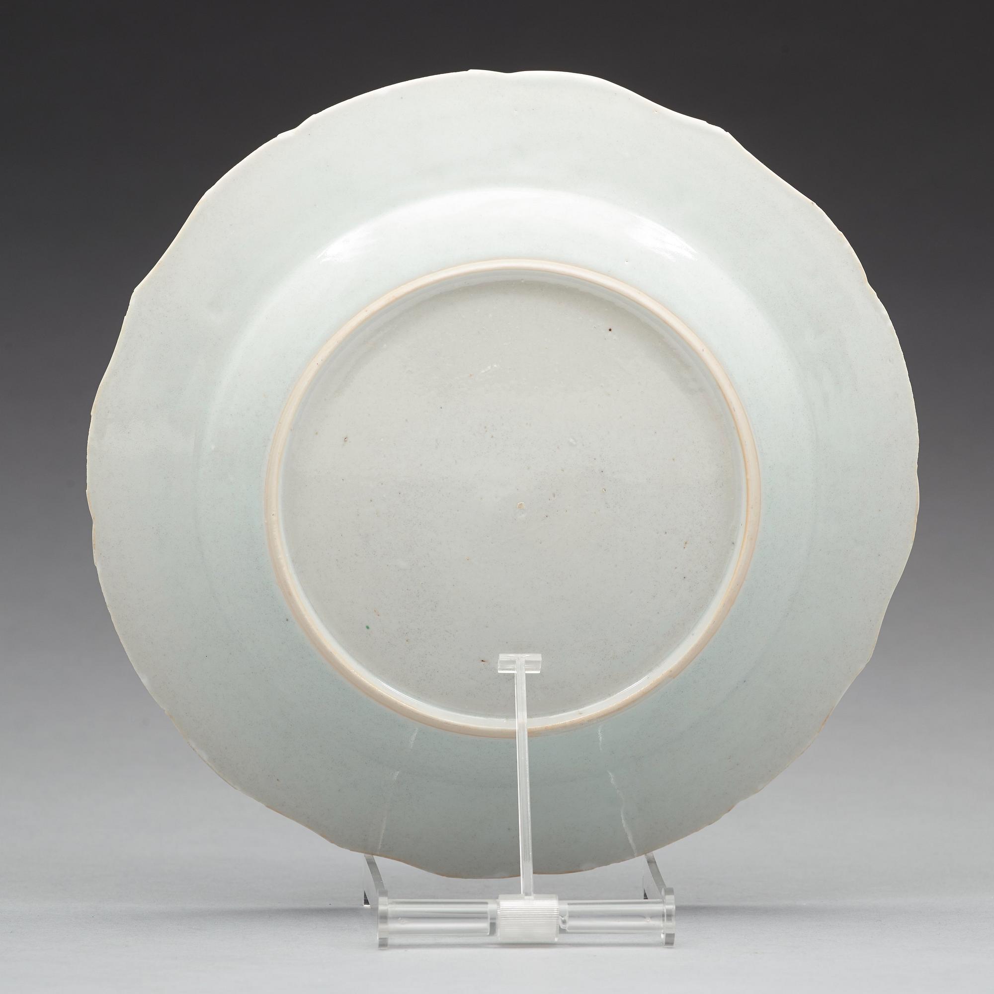 A set of 12 famille rose dinner plates, Qing dynasty, Qianlong (1736-95).