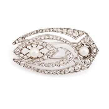 486. A silver brooch set with old- and rose-cut diamonds and pearls.