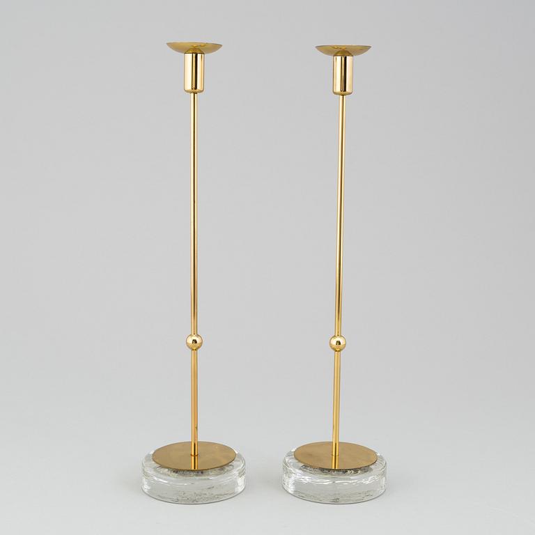 GUNNAR ANDER, A pair of Ystad metall brass candlesticks.