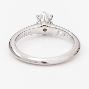 Tiffany & Co, A platinum ring with a ca. 0.26 ct diamond.