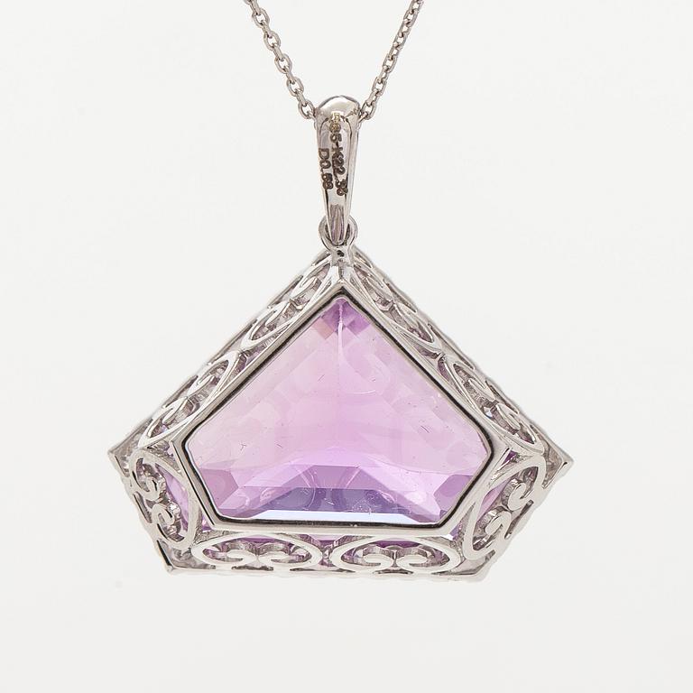 A 14K gold necklace with kunzite and brilliant cut diamonds.