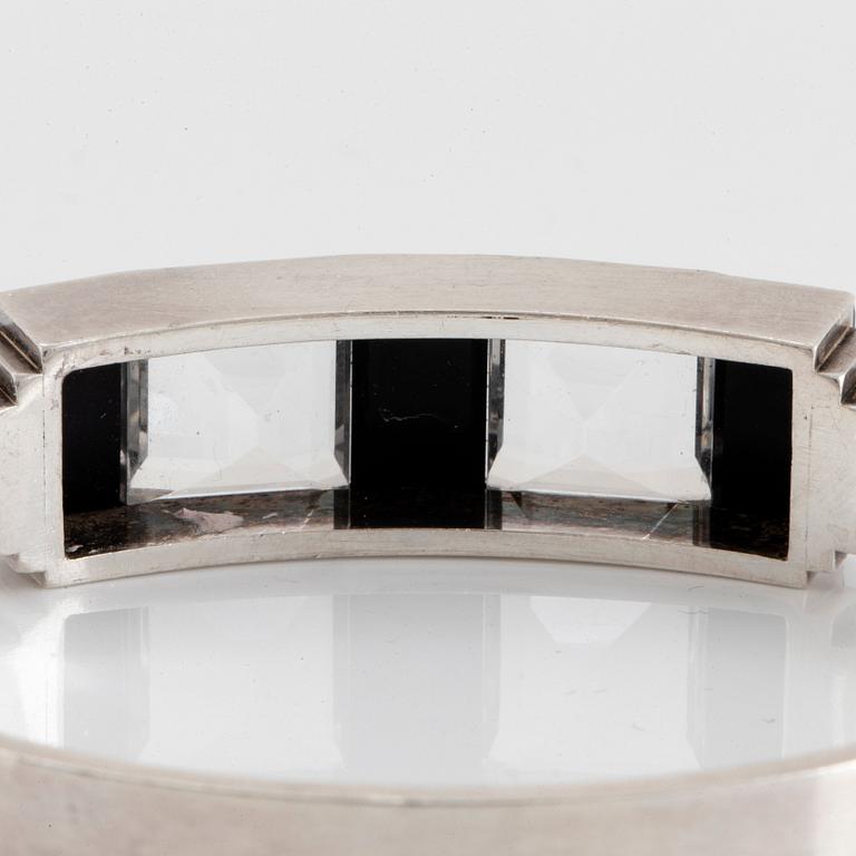 Wiwen Nilsson, a sterling silver bangle with facet cut rock crystal and onyx, Lund, Sweden 1940.