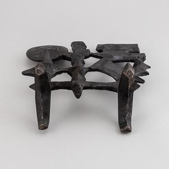 OLLE HERMANSSON, a cast iron sculpture, marked Husqvarna.