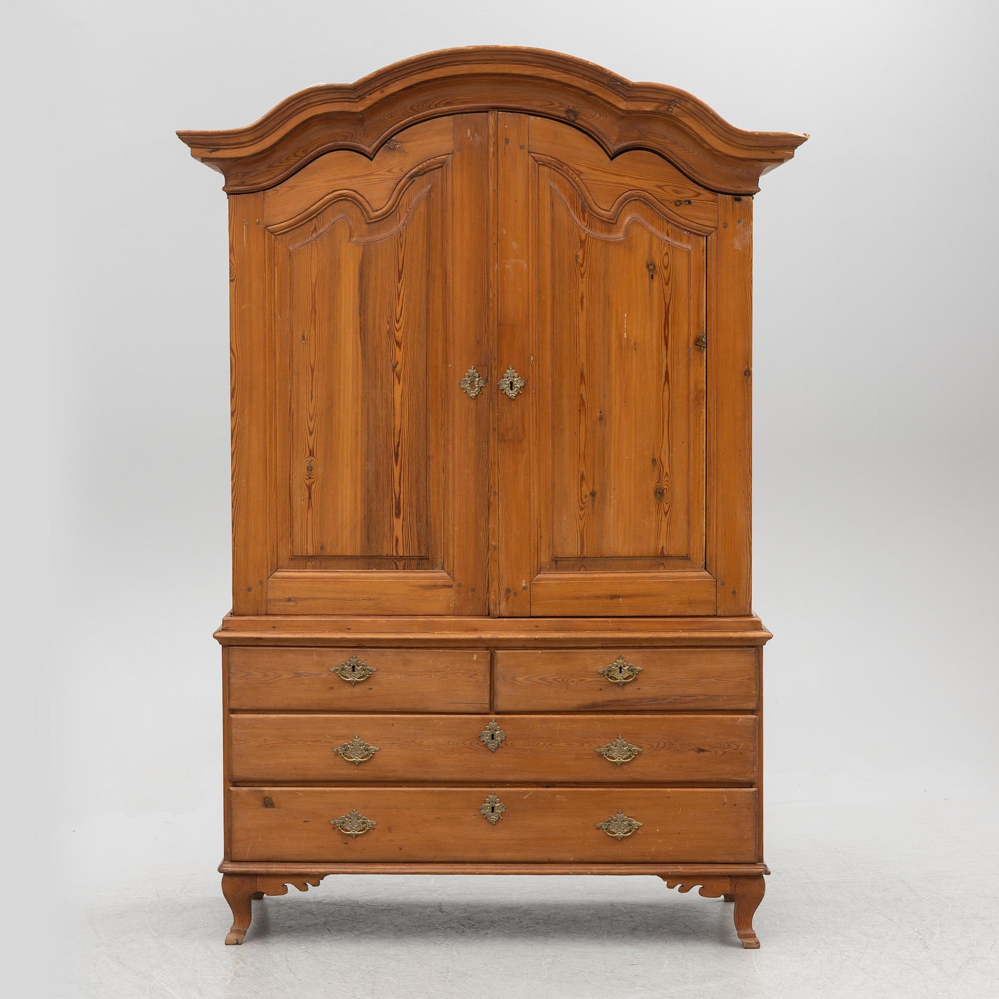 An 18th two-part pine century cabinet.