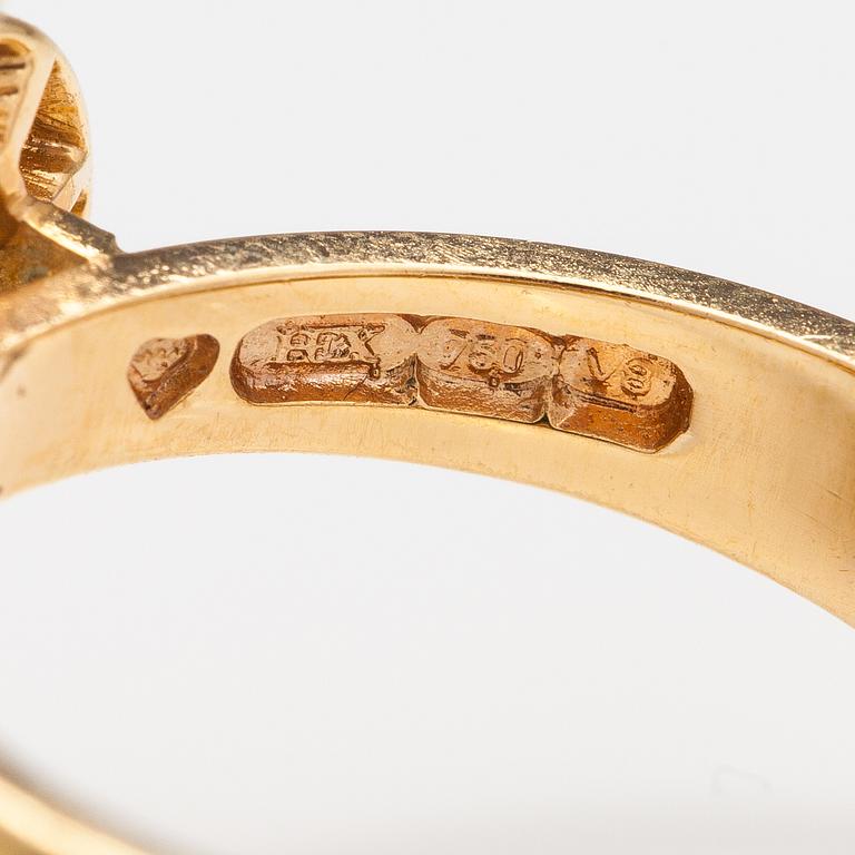 An 18K gold ring "Catherine Jagiellon" with diamonds ca 0.37 ct in total and topazes. Ofelia Jewelry, Helsinki 1998.