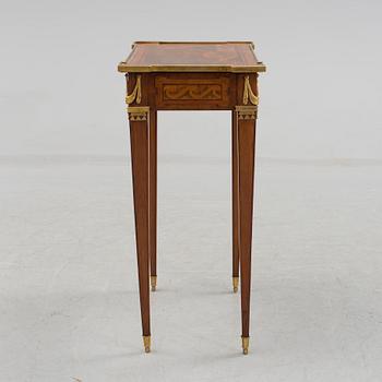 A Louis XVI-style circa 1900 occasional table.