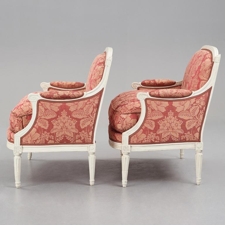 A pair of Louis XVI late 18th Century armchairs by M. dela Porte (Paris 1765-1784).