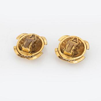 Chanel, a pair of gold tone and rhinestone clip-on earrings.