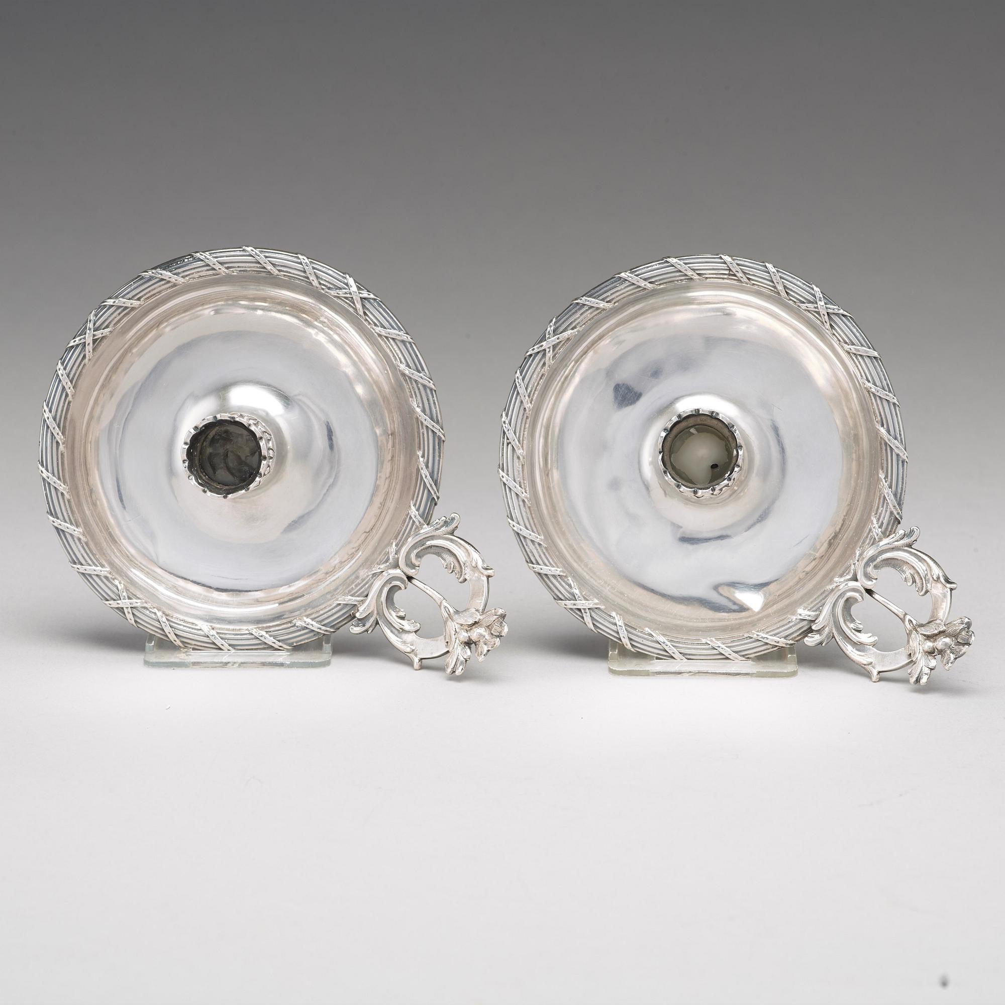 A pair of Swedish 18th century silver chamber-candlesticks, mark of Isak Sauter, Stockholm 1772.