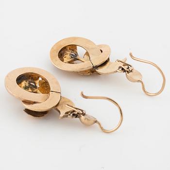 A pair of enamel and rose cut diamond earrings.