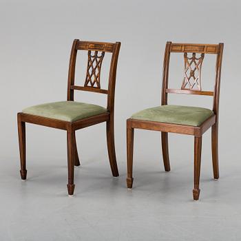 A set of eight chairs and a dining table, second half of the 20th century.