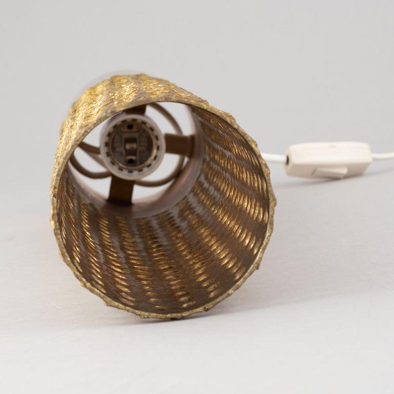 A brass table lamp by Pierre Forssell, second half of the 20th Century.