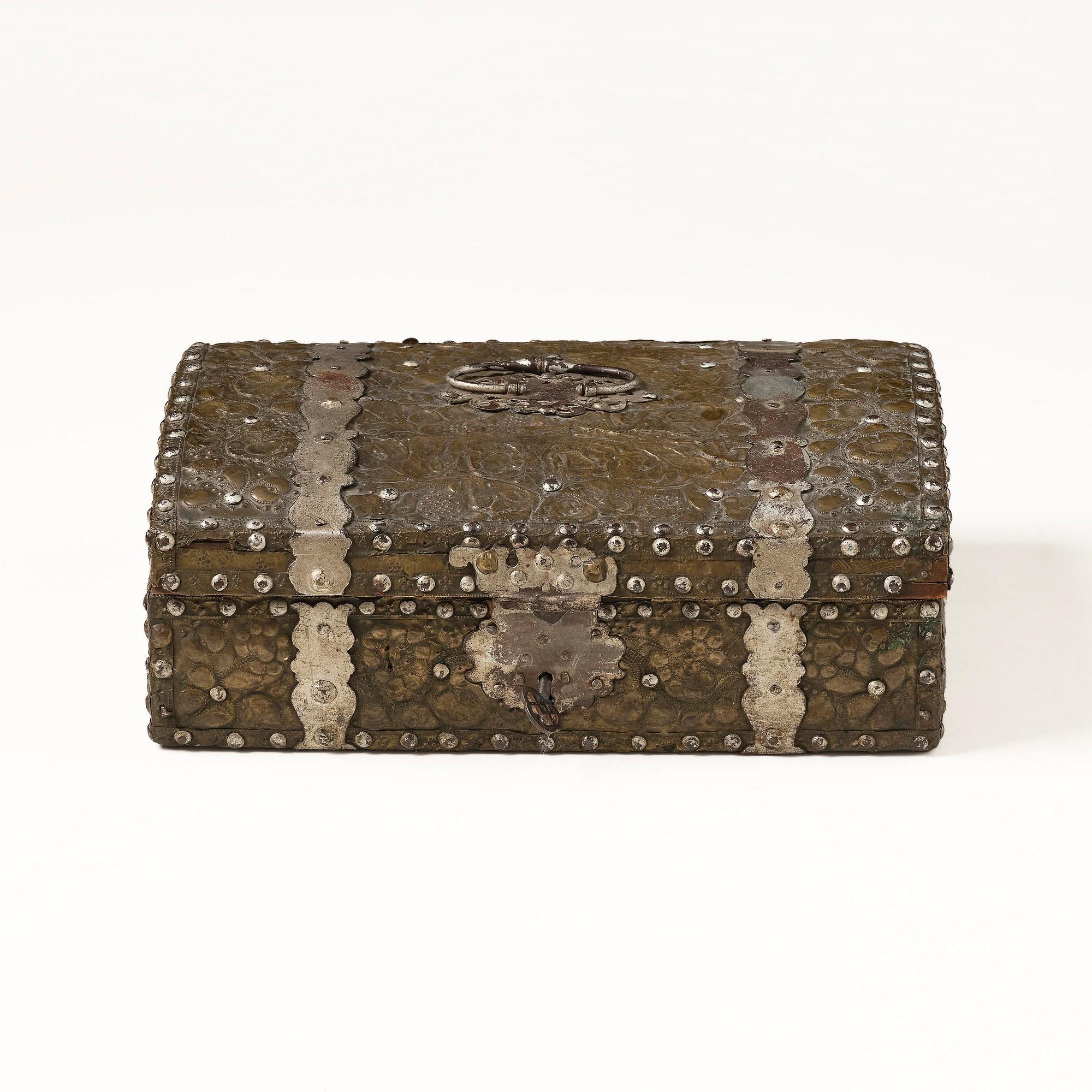 A presumably German baroque repoussé brass writing box, late 17th century.