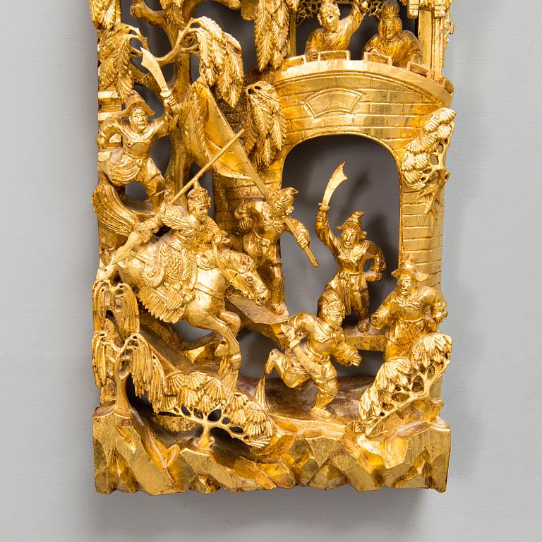 A Chinese carved and gilt wood panel, 20th century.