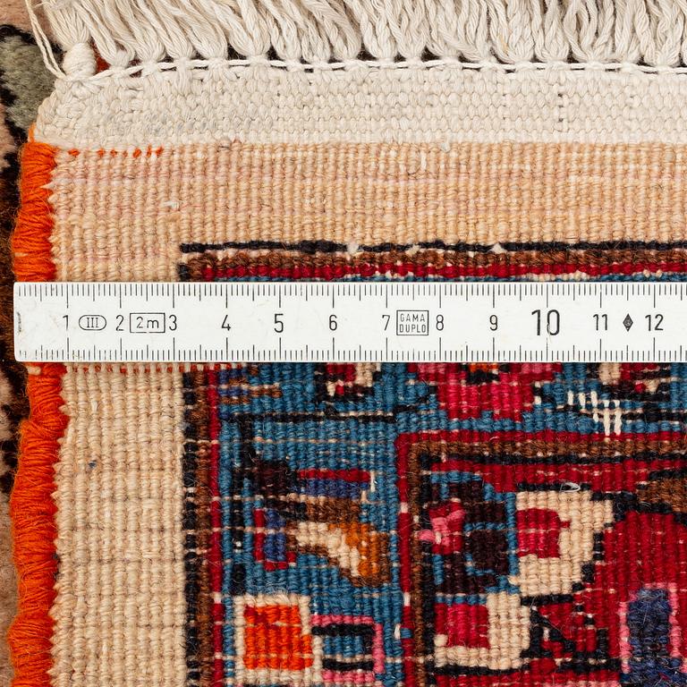 A carpet, semi-antique, Mashad, figural, ca 402 x 298 cm.