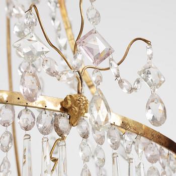 A German Louis XVI ormolu and cut-glass nine-light chandelier attributed to Johann Christoph Ermisch, late 18th century.