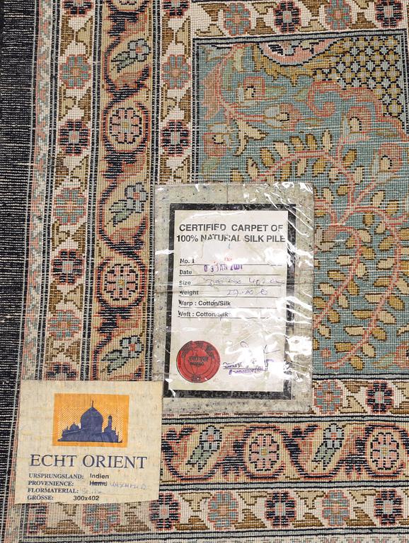 A silk carpet, Kashmir, c. 402 x 300 cm.