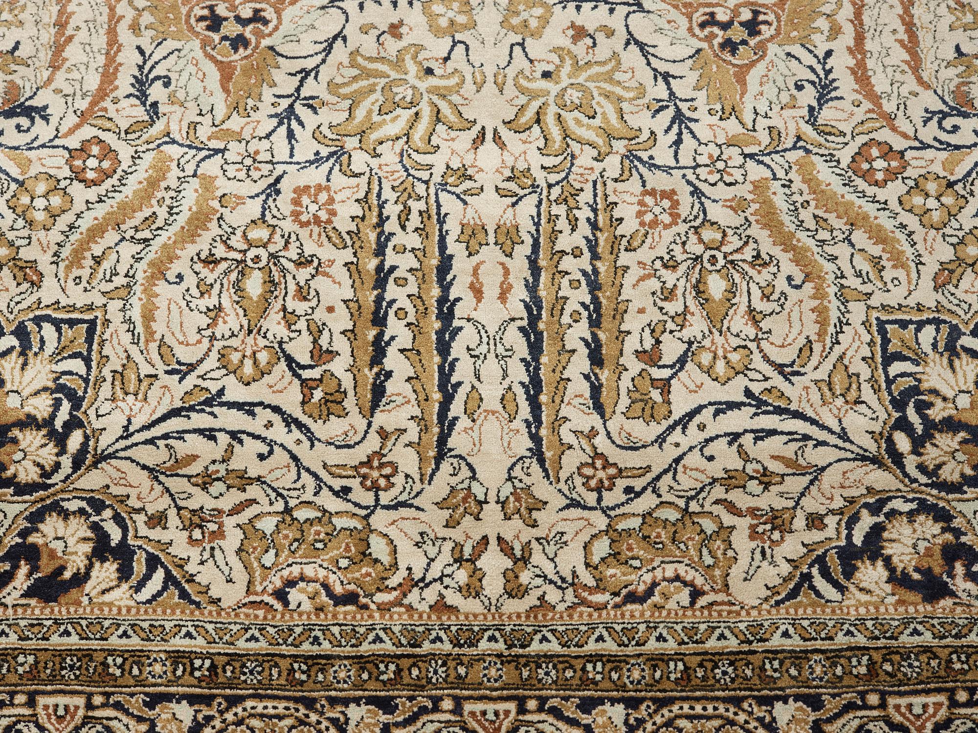 A silk Qum carpet, around  219 x 137 cm.