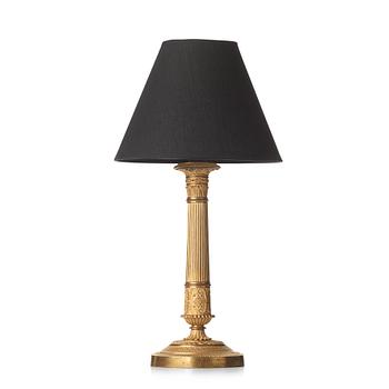 79. A French Empire early 19th century table lamp.