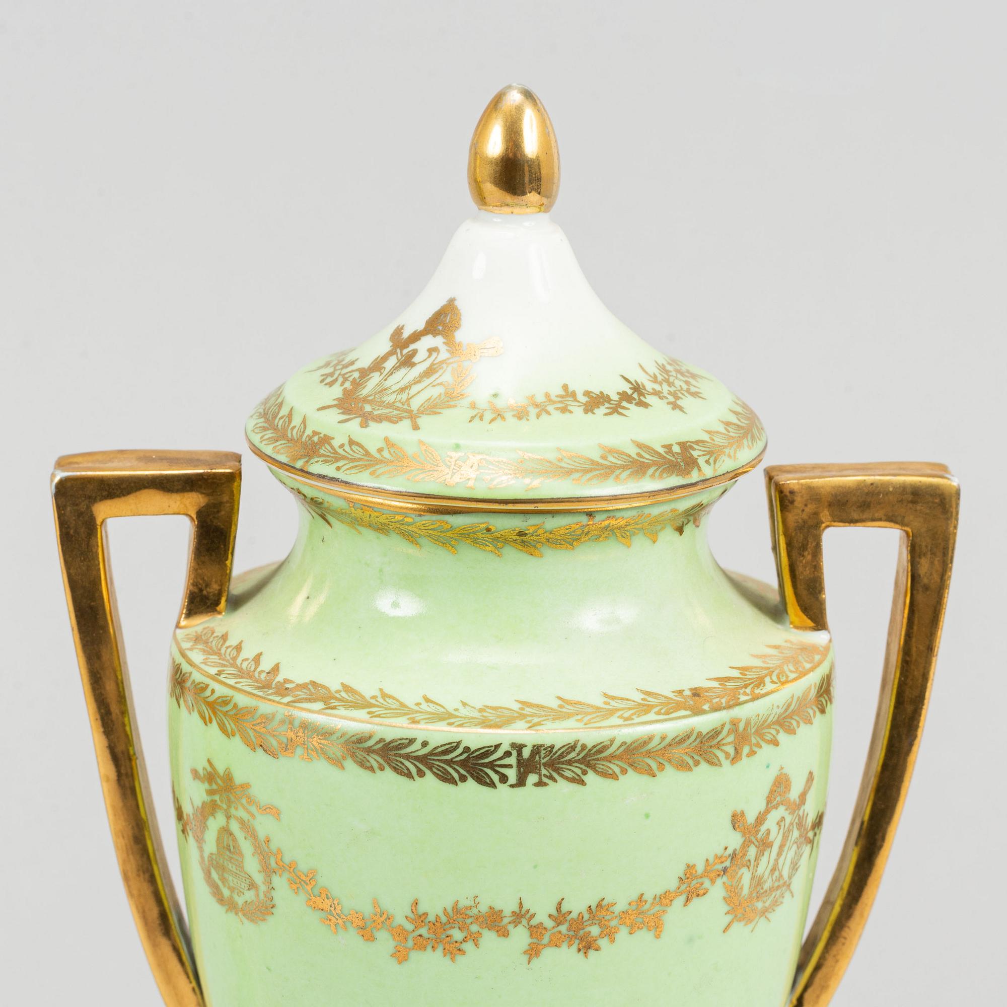 A pair of porcelain urns, possibly naples, first half of the 20th century.