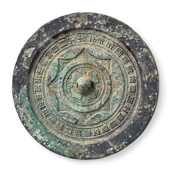 895. A circular bronze mirror, Han dynasty (206 B.C.-220 A.D.).