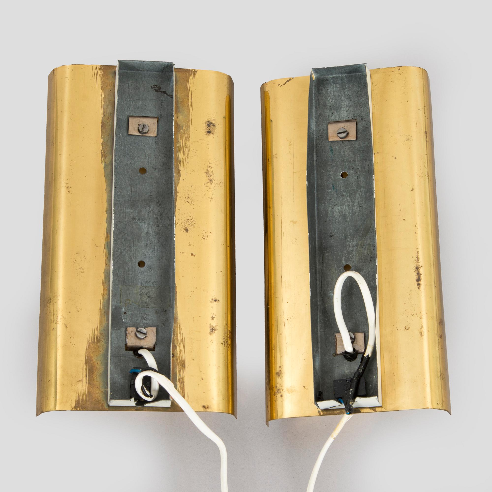 A pair of mid 20th century wall lights for Aris, Arisuo, Finland.