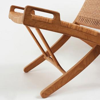 Hans J. Wegner, a pair oak and rattan "model 512" folding chairs by Johannes Hansen, Denmark 1950-60's.