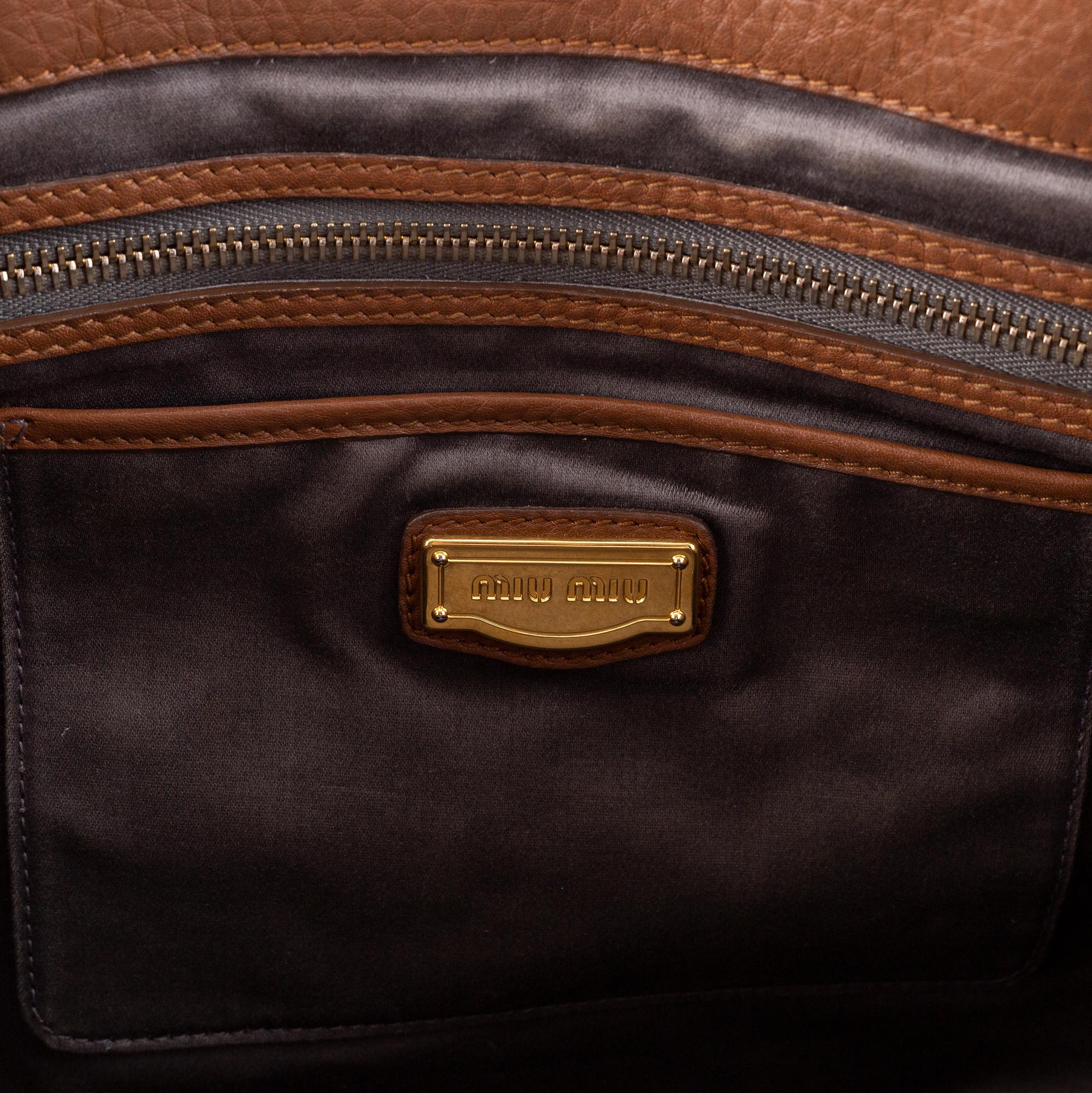 Miu Miu, a leather bag.