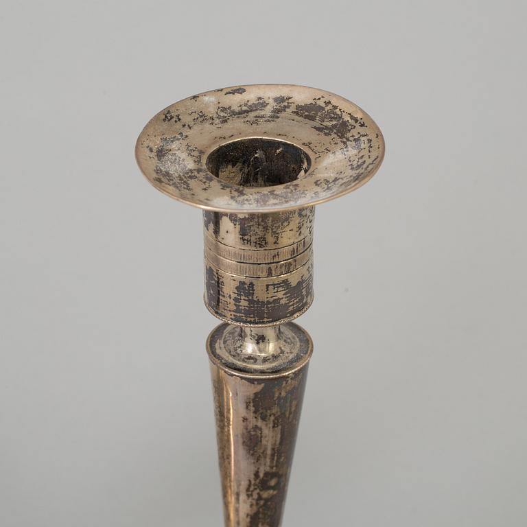 A pair of empire silver candles, presumably Stockholm, dated 1819.