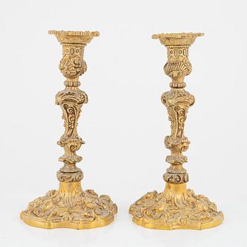 A pair of gilt bronze candle sticks, end of the 19th Century.