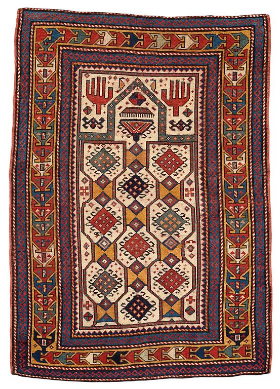 A RUG, an antique Caucasian prayer rug, Czar Russia, ca 144-151 x 103-106 cm.
