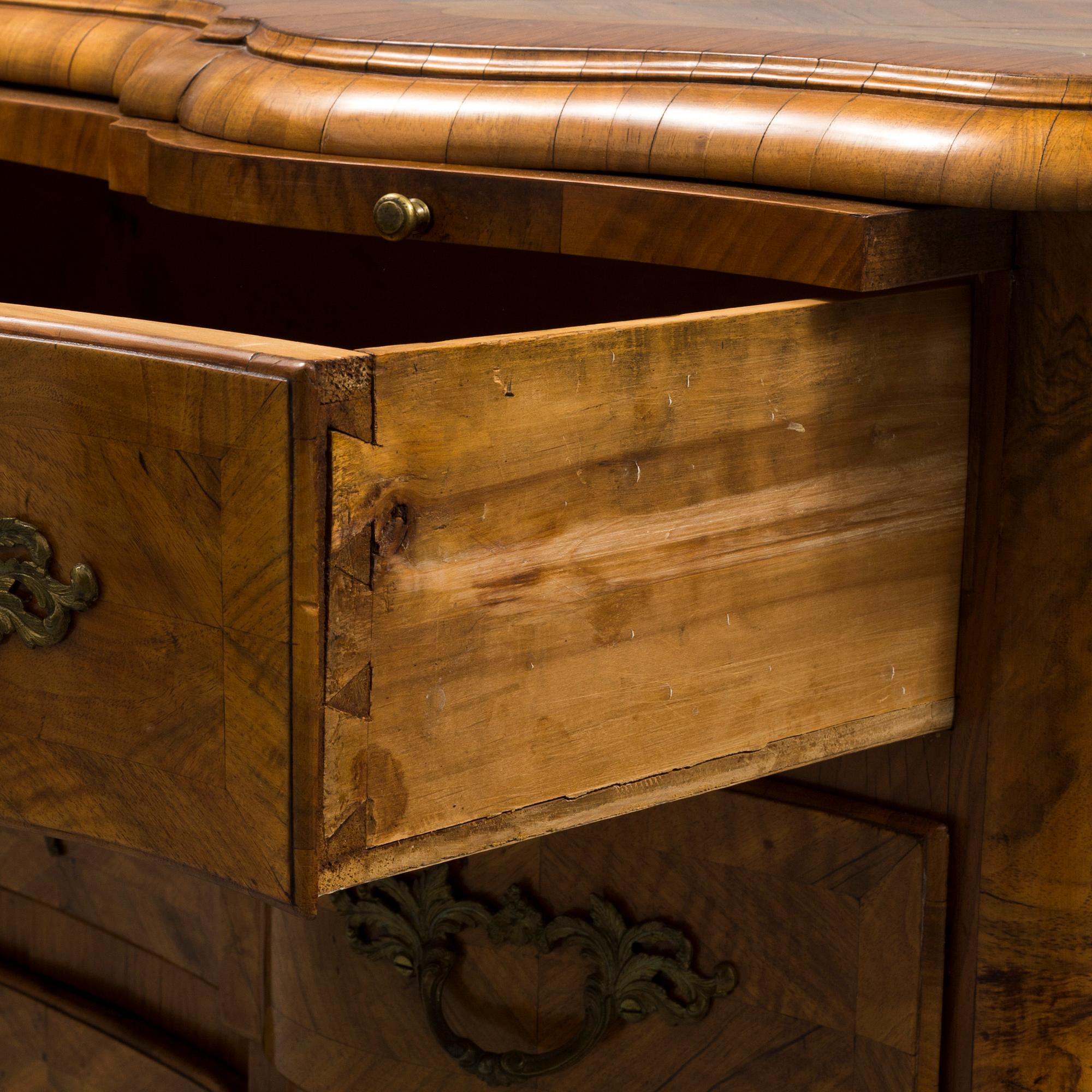 A late baroque mid 18th century chest of drawers by Christian Linning.
