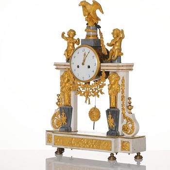 A French Louis XVI ormolu and marble portico mantel clock, late 18th century.