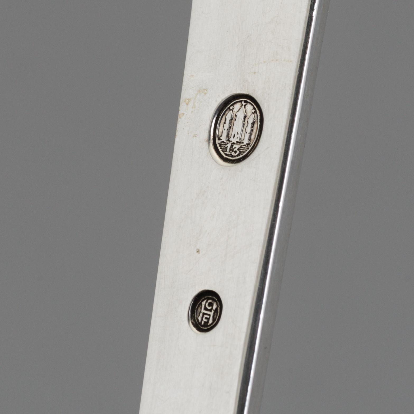 A two-piece Danish Art Nouveau silver serving set, design Thorvald Bindesbøll, maker's mark Rasmus Jensen, Horsens 1913.