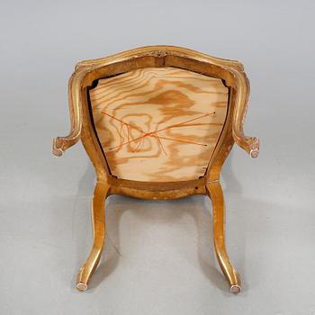 A pair of chairs from the first half of the 20th century.